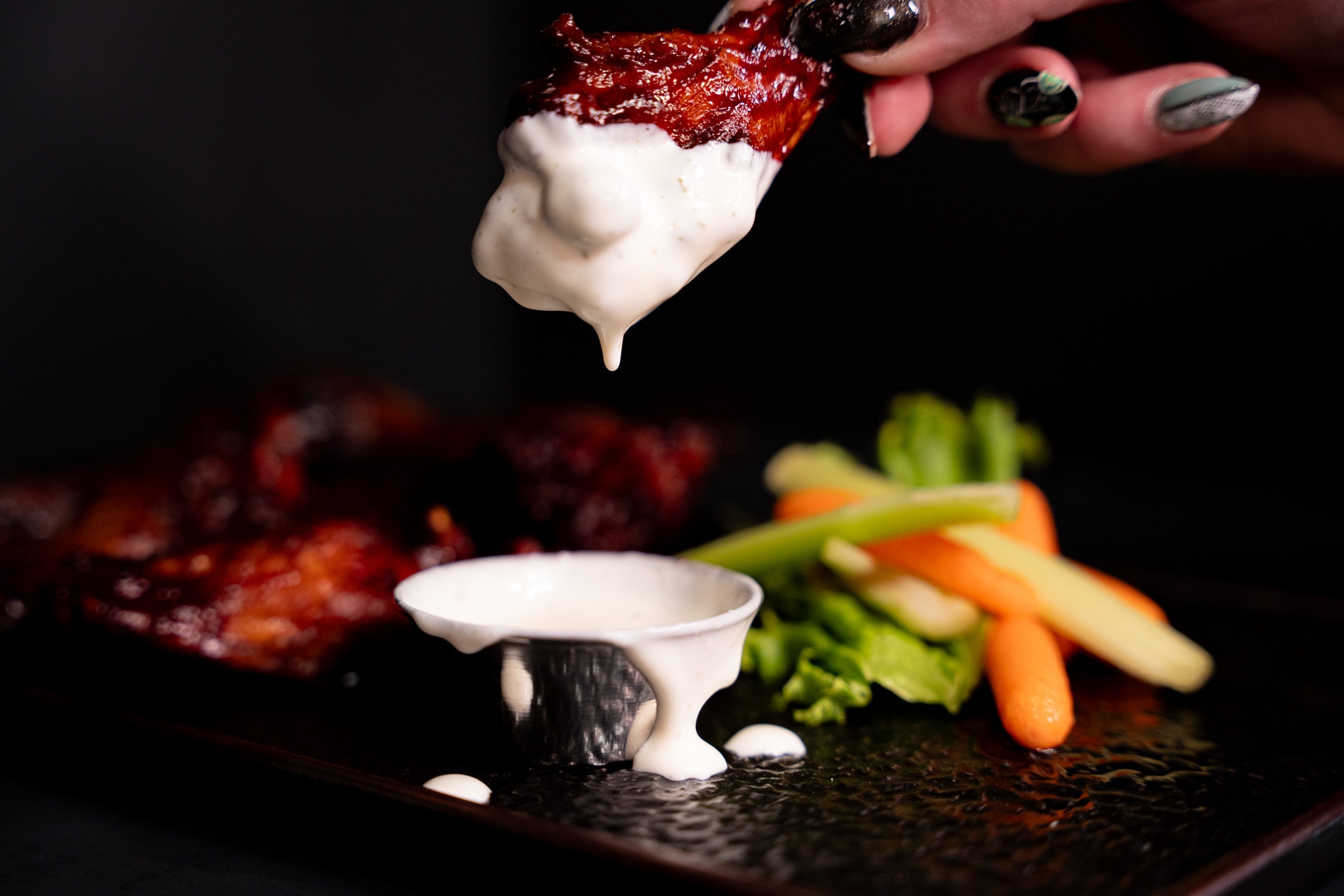 Chicken wing coated in creamy dipping sauce