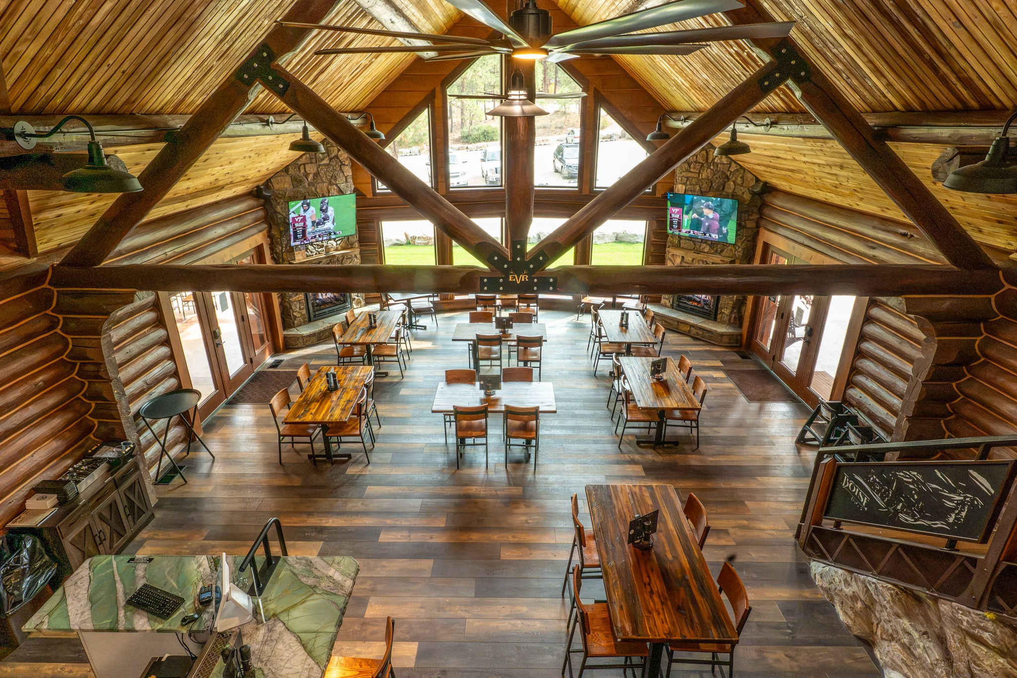 Lodge dining room with stone fireplace
