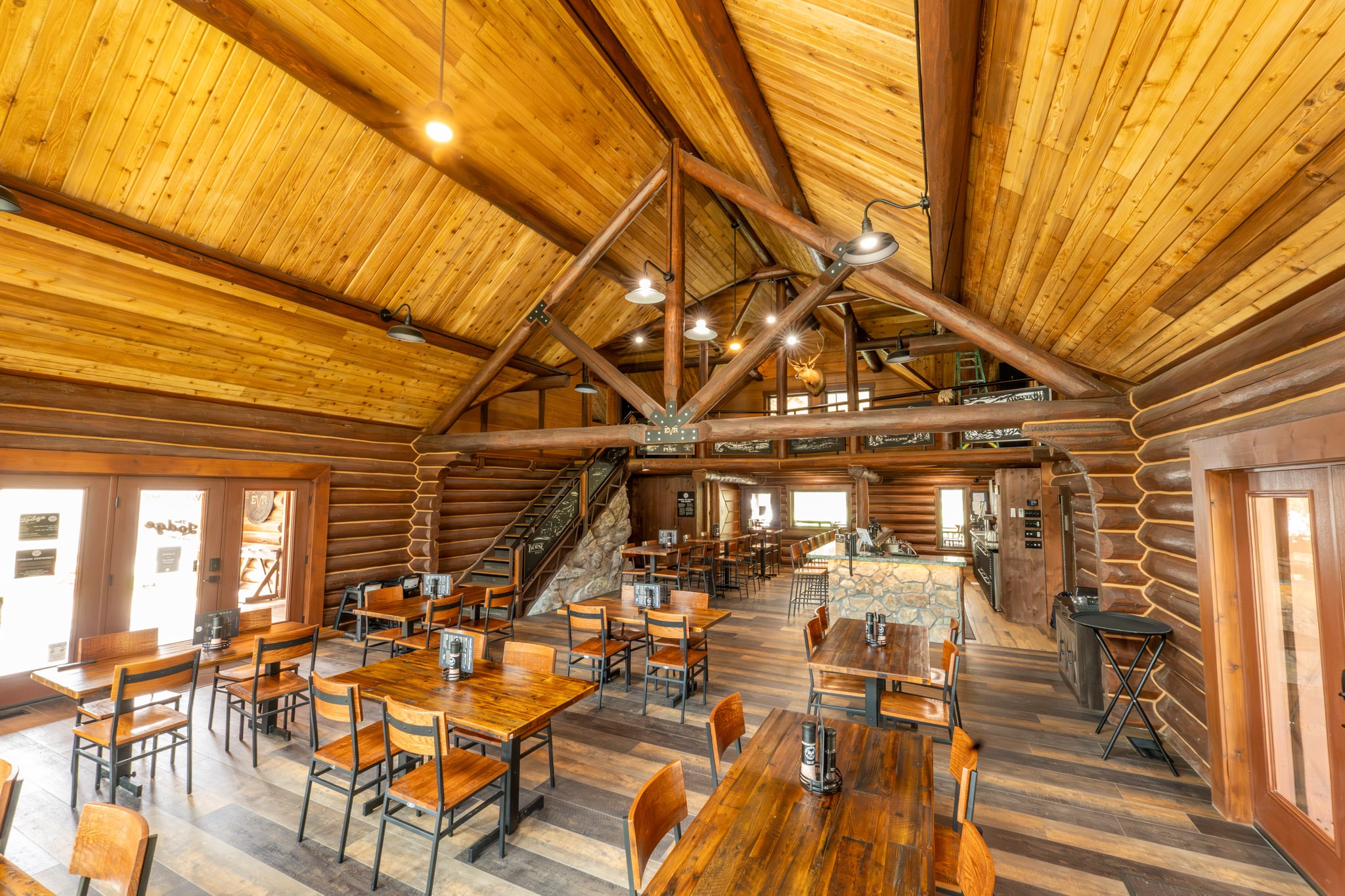 Lodge dining room beneath a timber ceiling