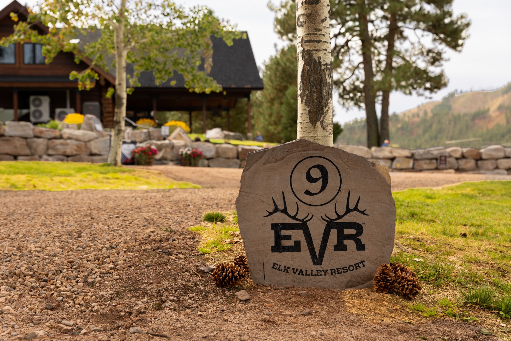 RV site marker beside landscaped grounds