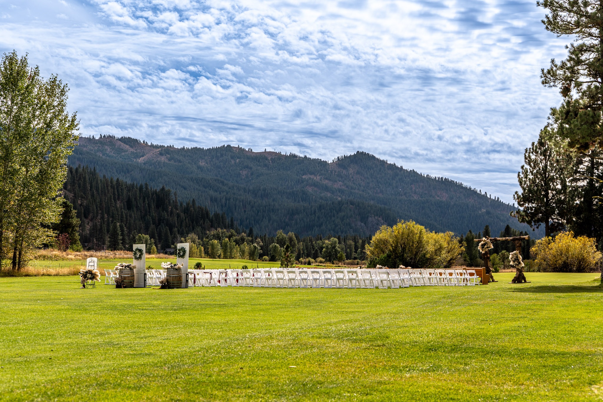 Ceremony seating surrounded by lawns and mountain views