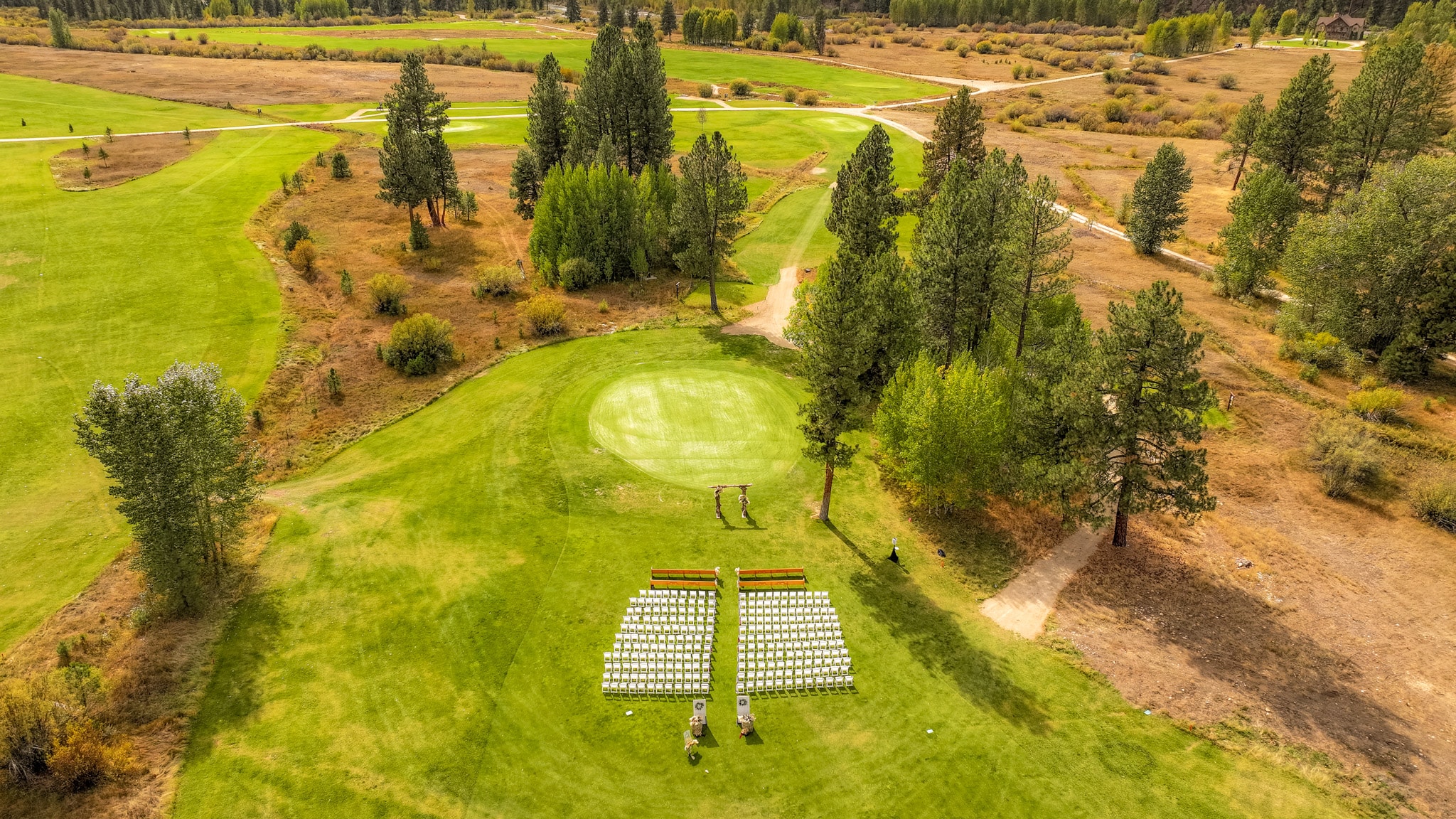 Aerial view of wedding seating on the resort lawn